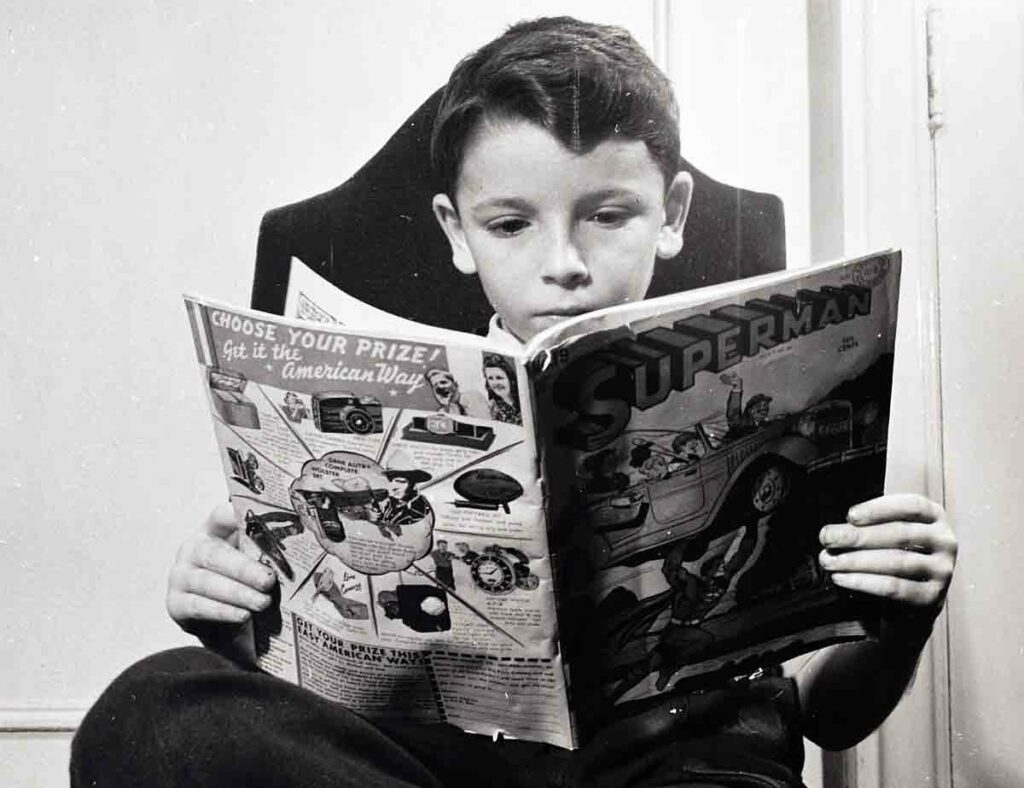 boy reading superman comics 1940s